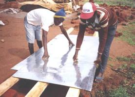 Marking an iron sheet into three stripes with a wire